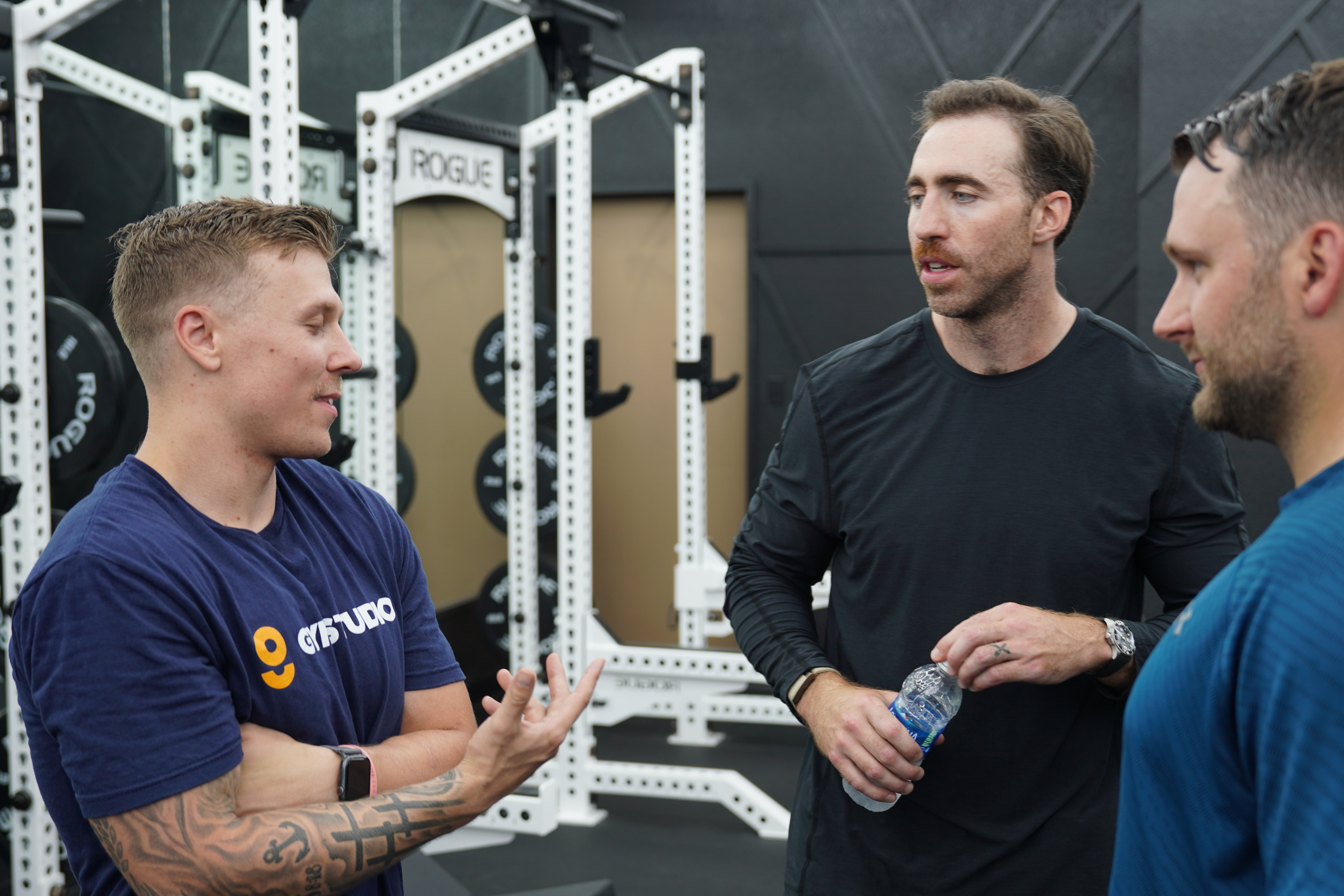 Gym owner and member talking